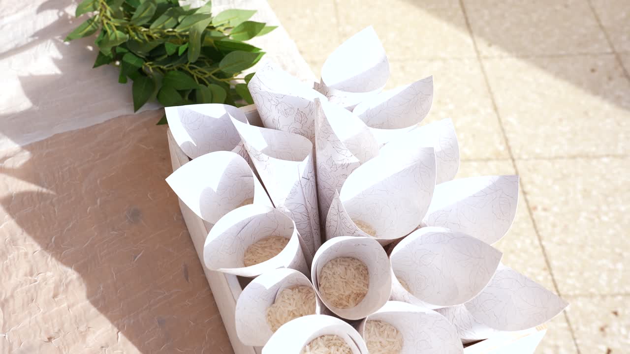 Beautifully designed rice cones arranged in a decorative box for a celebration outdoors