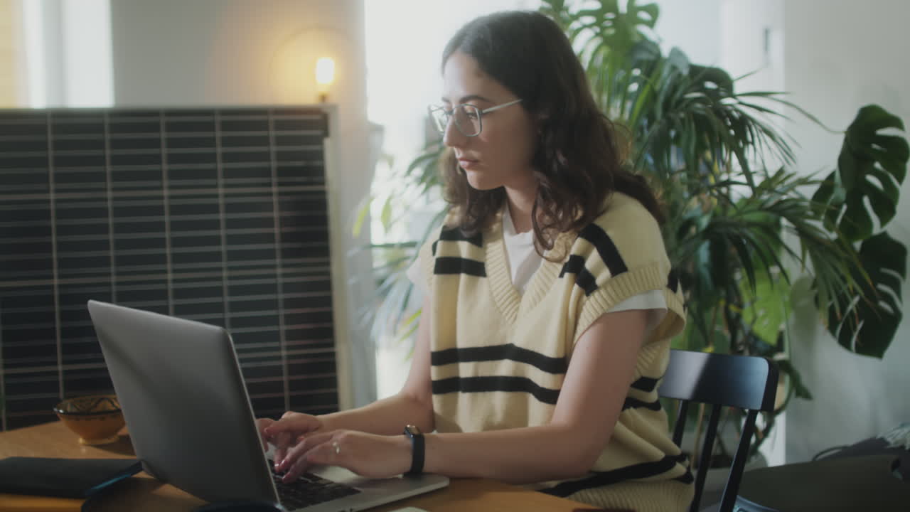 Girl Using Laptop in Home Office with Solar Panel