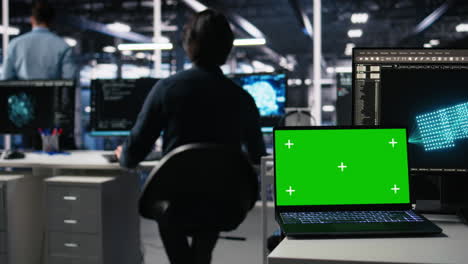 data center engineer working on neural network on chroma key laptop