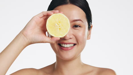 Lemon-skincare,-face-and-woman-in-studio