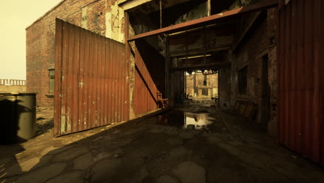 abandoned brick building with rusty metal doors