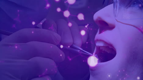 Dental-examination-animation-showing-molecular-structure-with-glowing-particles