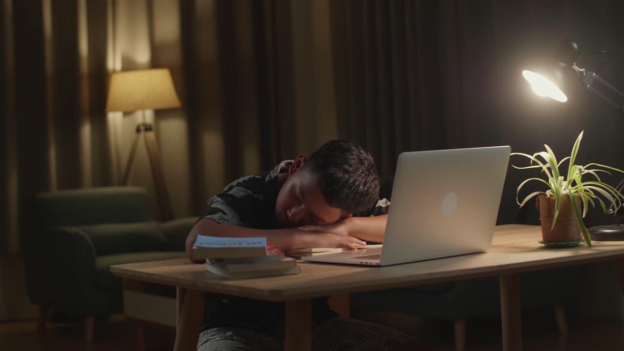 Sleepy Student Doing Homework at Night