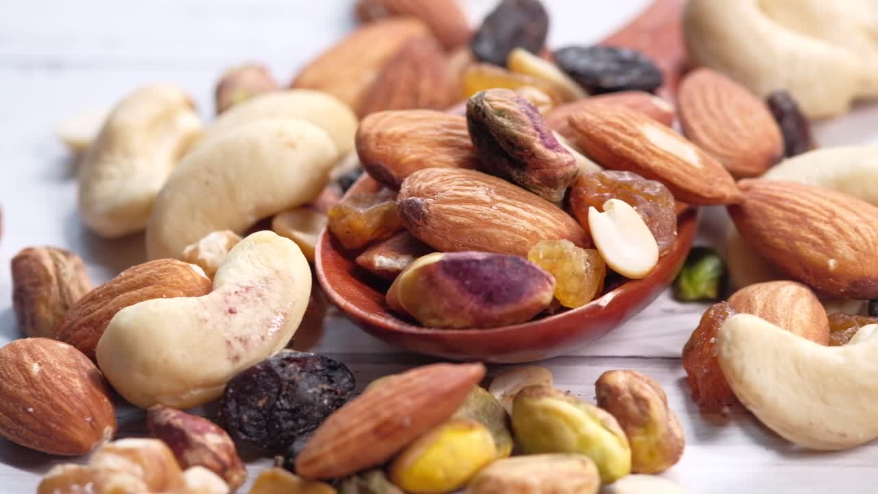 Mixed Nuts and Dried Fruit in a Wooden Spoon