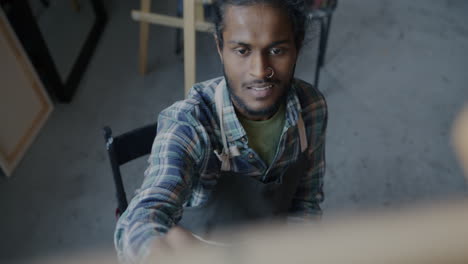 artist painting in studio