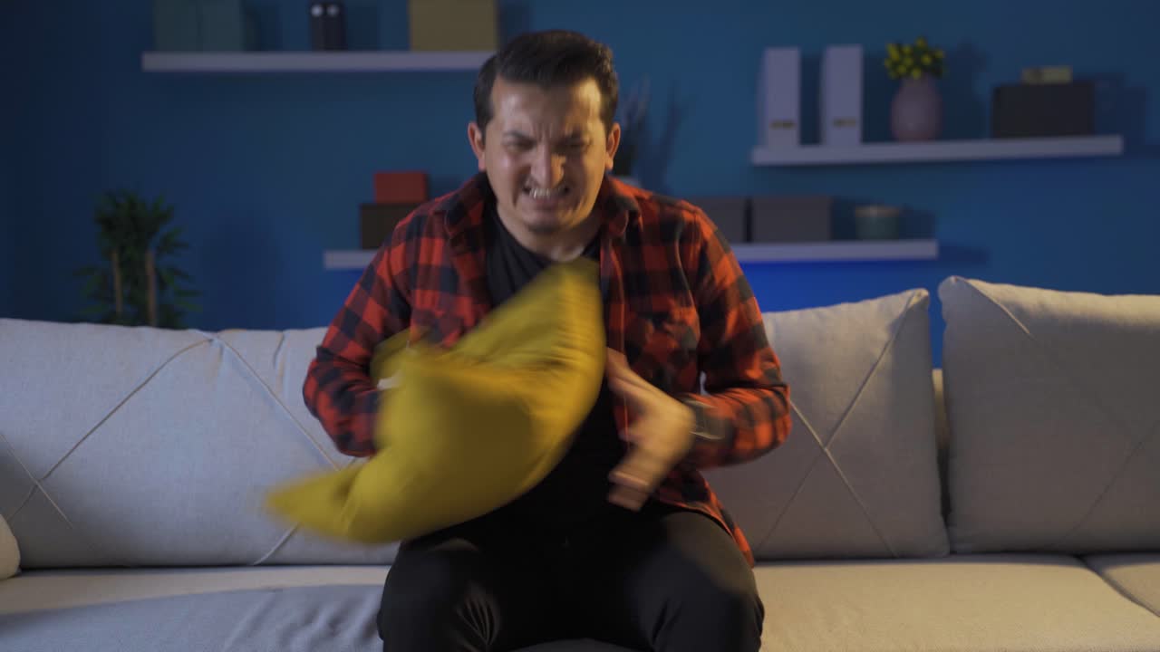 Man having a nervous breakdown at home is shouting.