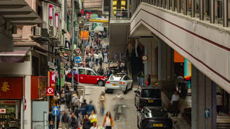 hong kong - 19 march 2025 : timelapse looking down onto a street scene in hong kong central