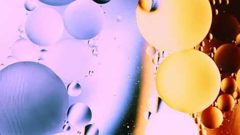 real abstract colourful oil drops in water rotation with color gradient mixing background