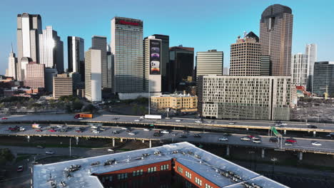 flying past a downtown skyline on a sunny morning