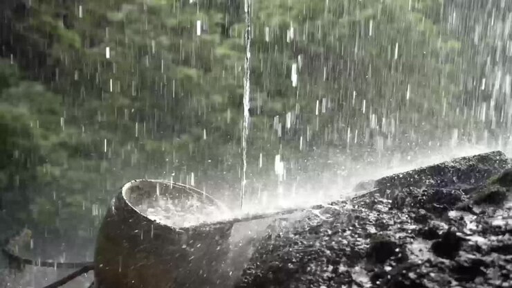 Traditional way of collecting water from rain with urn the earthen jar