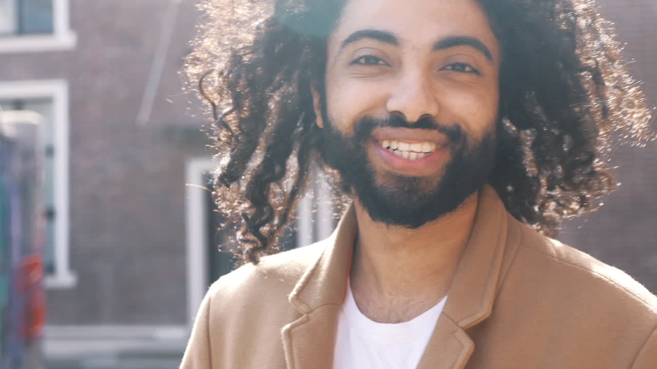 Man with Curly Hair and Beard Outdoors