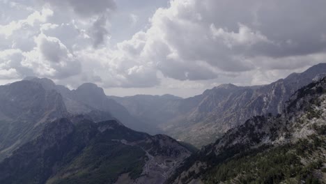 Drone-video-of-"Frontal"-plane,-advancing-on-the-highest-of-the-sh21-the-Theth-mountain-pass-in-albania,-Gjecaj