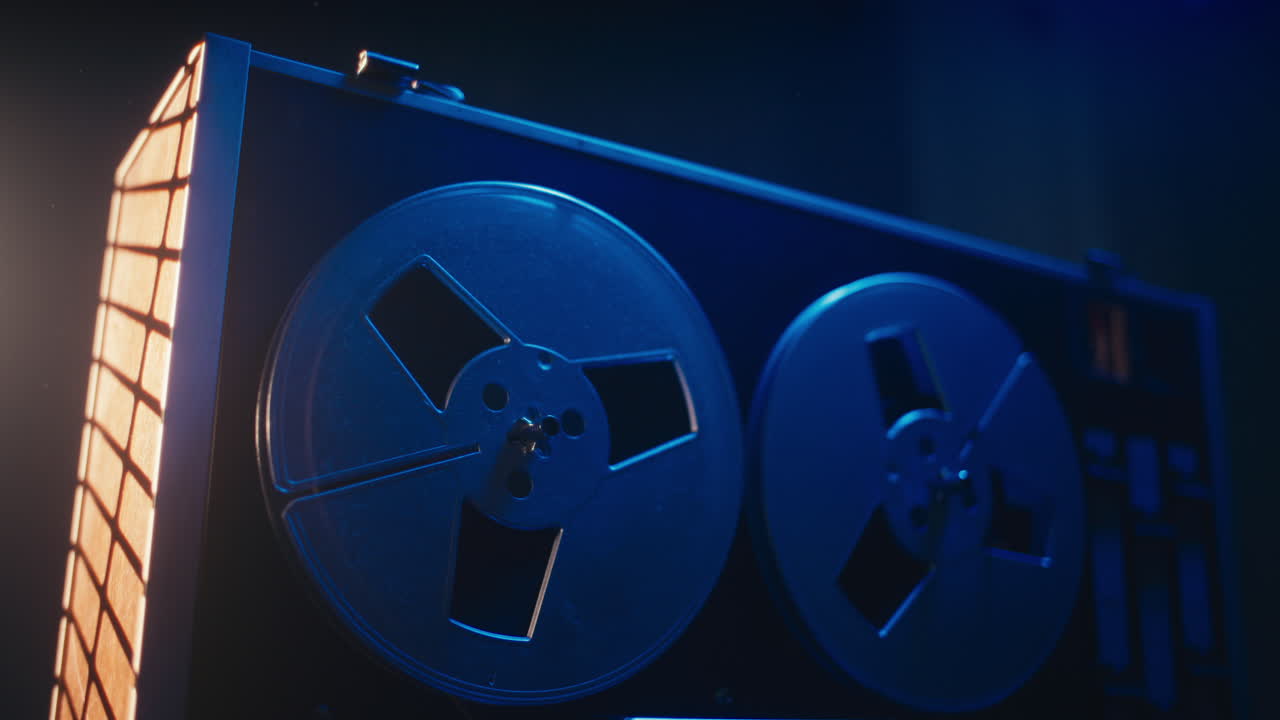 A vintage tape recorder in a blue light