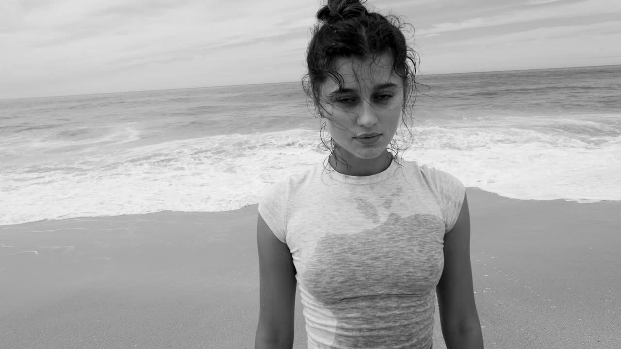 Black and white portrait of a woman on the beach