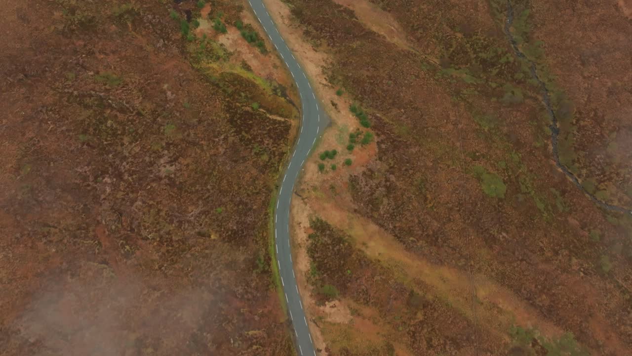 Top down view of winding road on top of mountain in Norway
