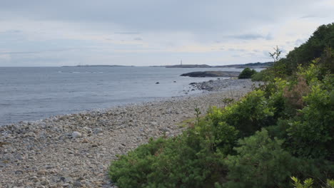 tranquil beach on a cloudy day in norway - wide shot