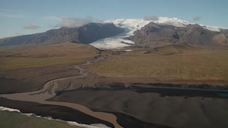 Glacial-River-From-Kviarjokull-Glacier-Outlet-In-From-South-Site-Of-Oraefajokull-Glacier-In-South-Iceland---pullback-drone