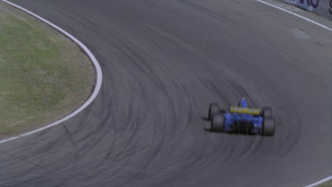 formula cars compete on a circuit track