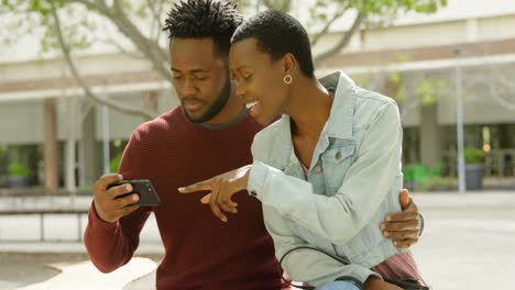 couple using mobile phone in city 4k