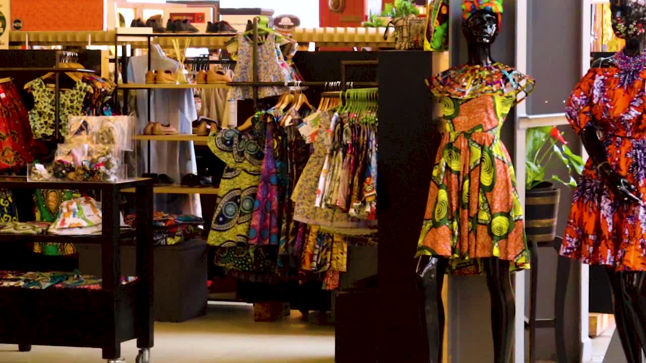 Colorful African Clothing Market 4K 30fps Slow Pan shot