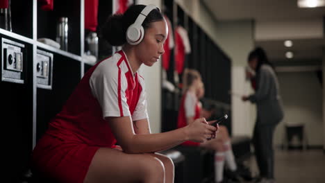 female soccer player in locker room