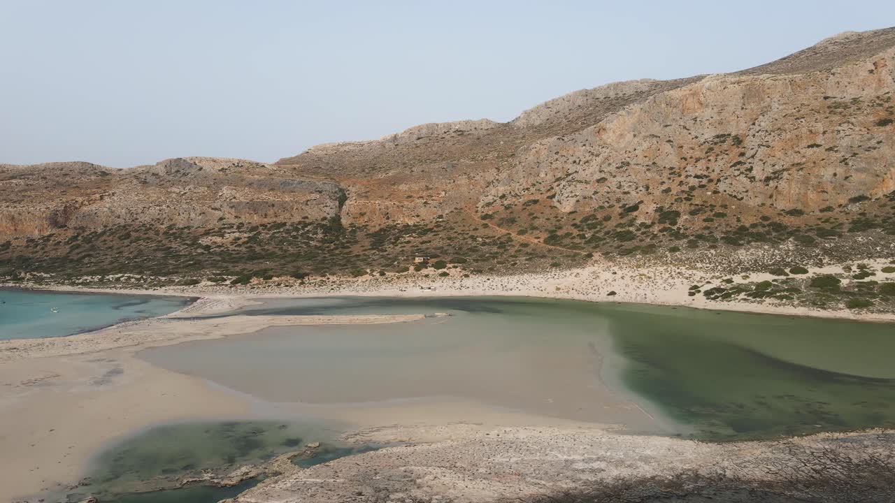 Aerial video of isolated Balos beach covered with white sand