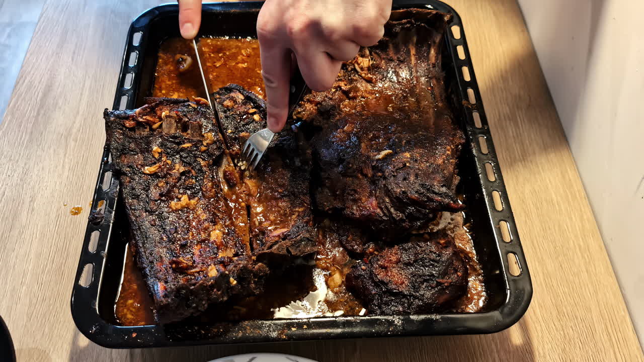 Ribs BBQ meat meal cooked in the oven with spices, cutting meal prep plating