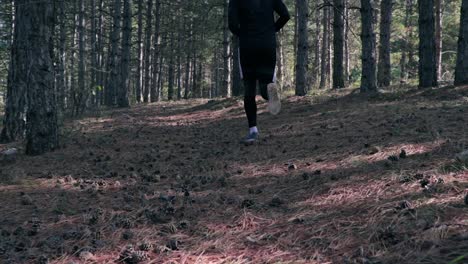 Man-running-through-the-woods-slow-motion