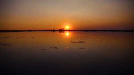 view of a beautiful sunset over a lake in botswana