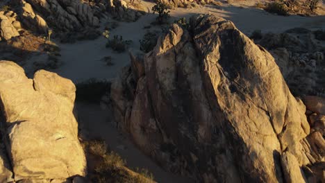 passing over boulders in a desert landscape via drone