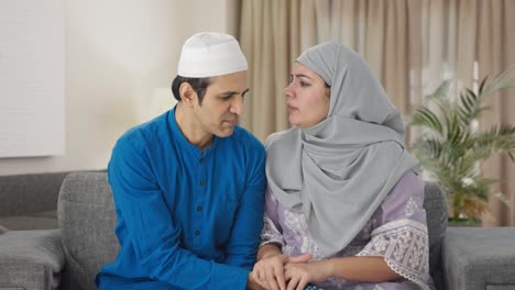 muslim couple fighting for tv remote