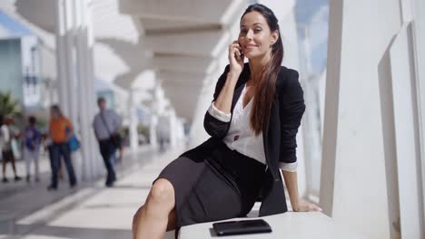 Businesswoman-taking-a-call-on-her-mobile