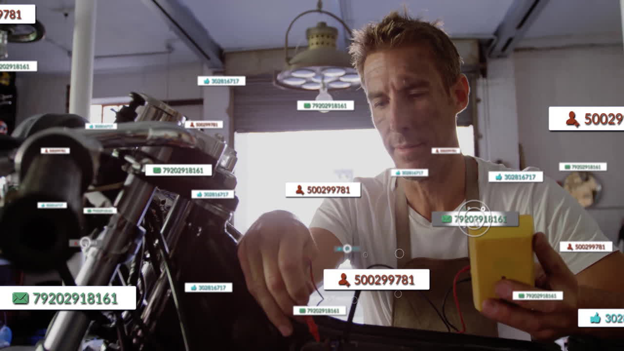 Male mechanic testing motorcycle wiring in automotive garage, displaying floating user icons