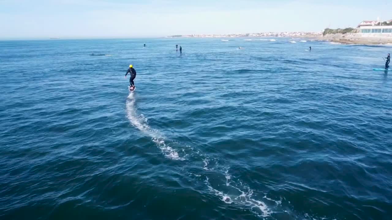 Man Riding an eFoil on the Ocean