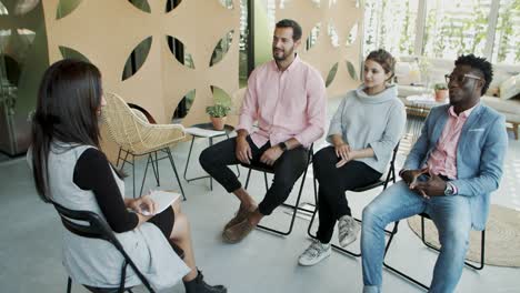 smiling people listening attentively their colleague