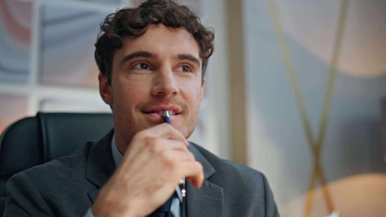 Inspired manager reading contract at cabinet closeup. Smiling man pondering
