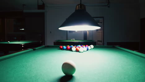 pool table in a dark room at night