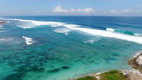 wild tropical beach with powerful waves near bali