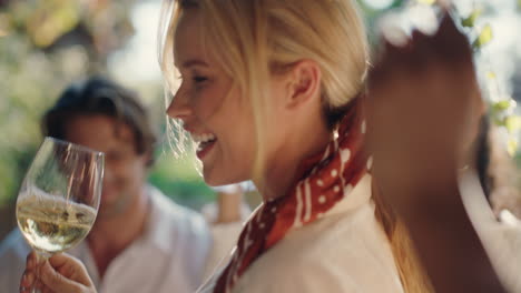 happy-woman-dancing-with-friends-at-summer-dance-party-drinking-wine-enjoying-summertime-social-gathering-having-fun-celebrating-on-sunny-day-4k-footage