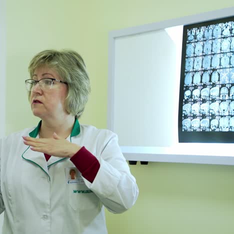 doctor checking x-ray scan. female doctor analyzing result of patient scan