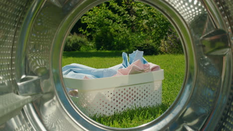 laundry basket in a garden with washing machine