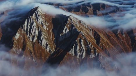 majestic mountain peaks emerging through clouds