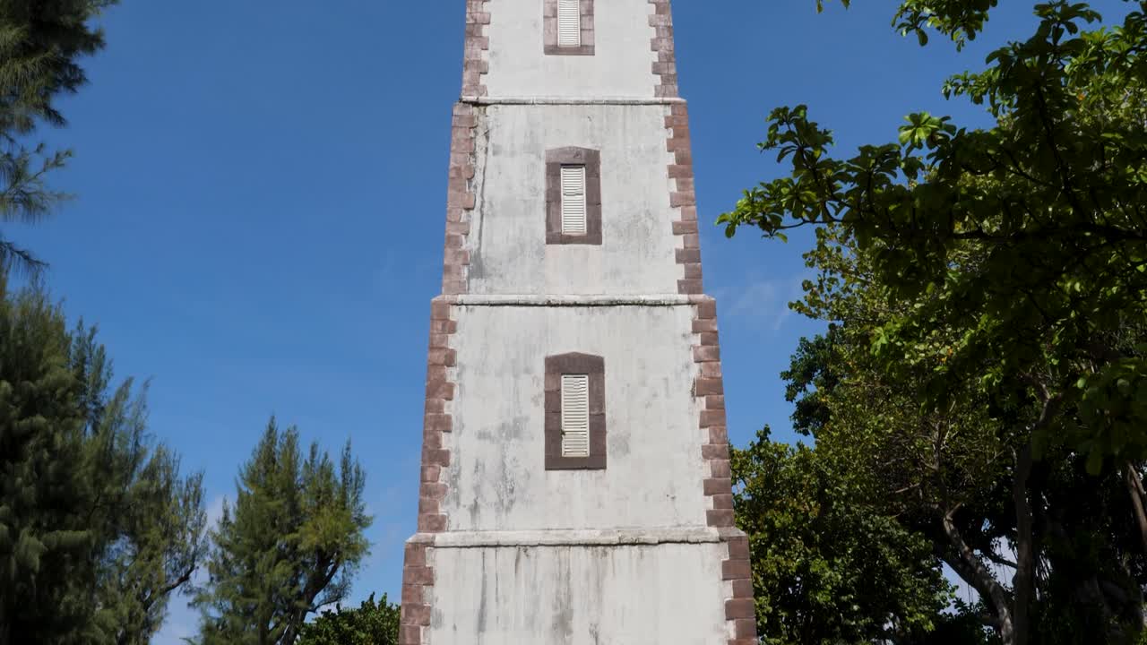 Point Venus historic lighthouse, Papeete, Tahiti, French Polynesia. Slow tilt up camera.