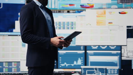 professional businessman analyzing info and finance charts on digital dashboard