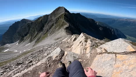 first-person view resting on a majestic mountain ridge
