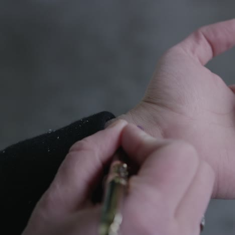 man writing code on hand