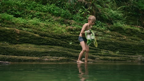 boy in a creek