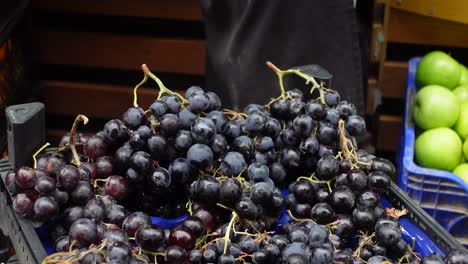 fresh black grapes at a market