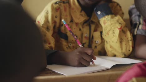 close up of child writing