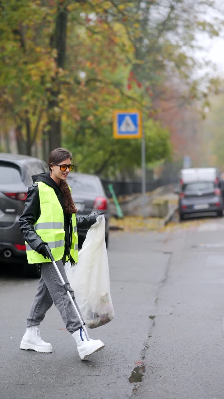 Woman Cleaning Up Litter on City Street